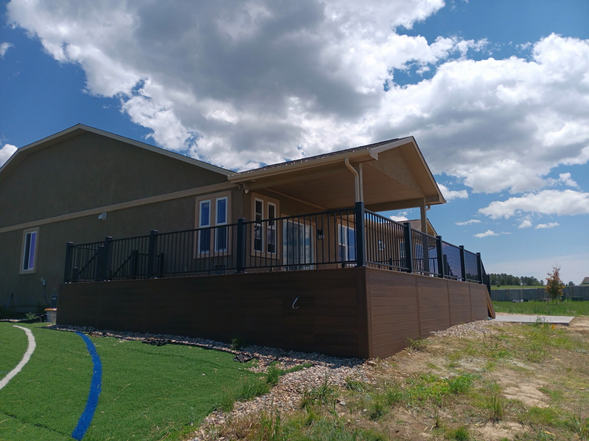 Covered outdoor kitchen and dining deck