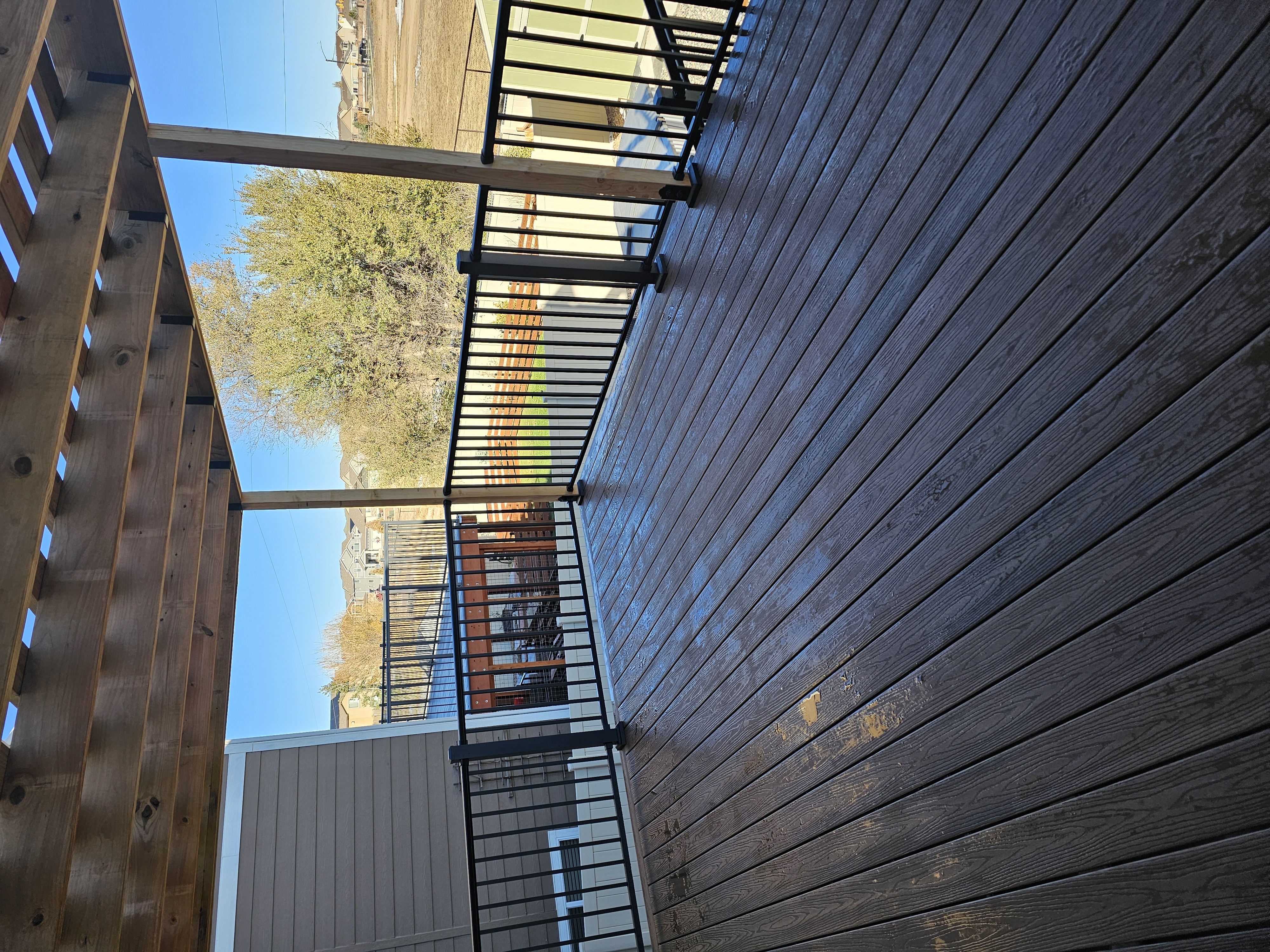 Custom cedar pergola over a backyard deck in the Pikes Peak region
