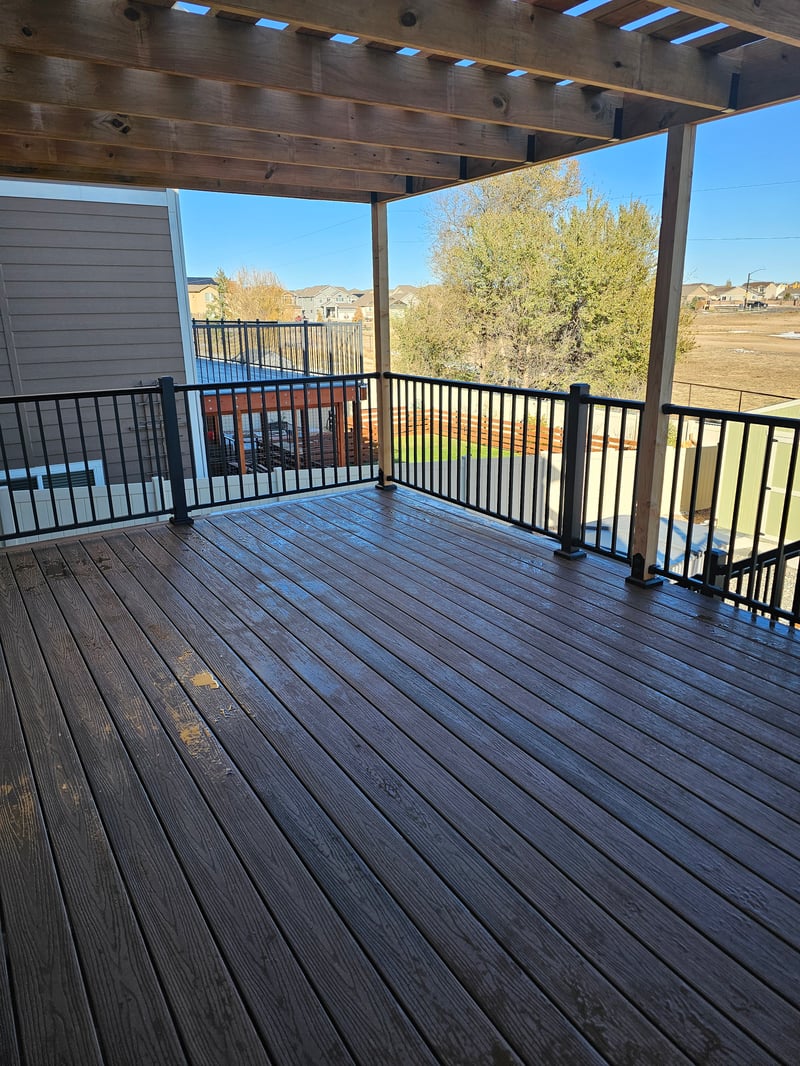 Custom cedar pergola over a backyard deck in the Pikes Peak region