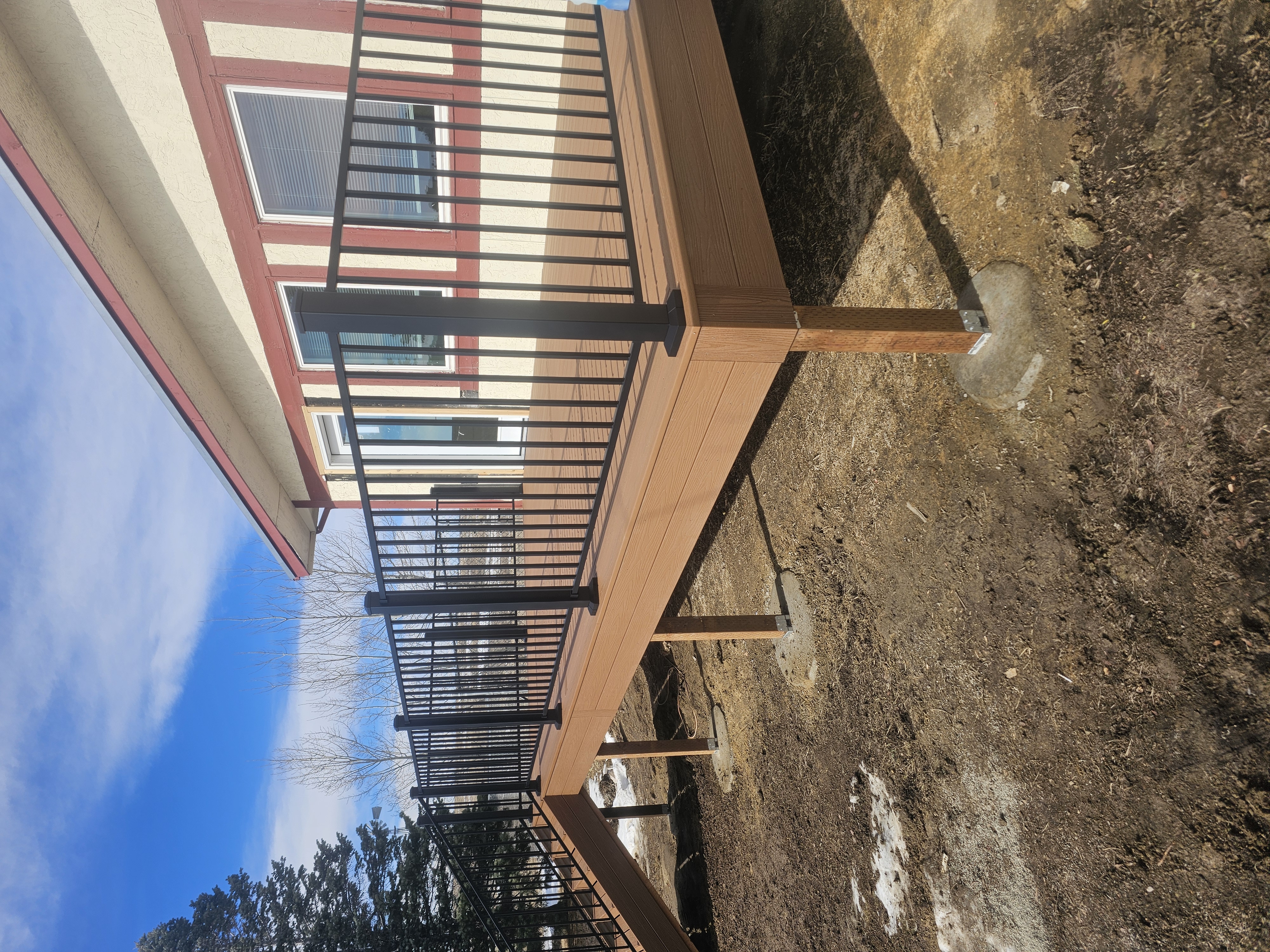 Backyard deck with pergola and outdoor dining area