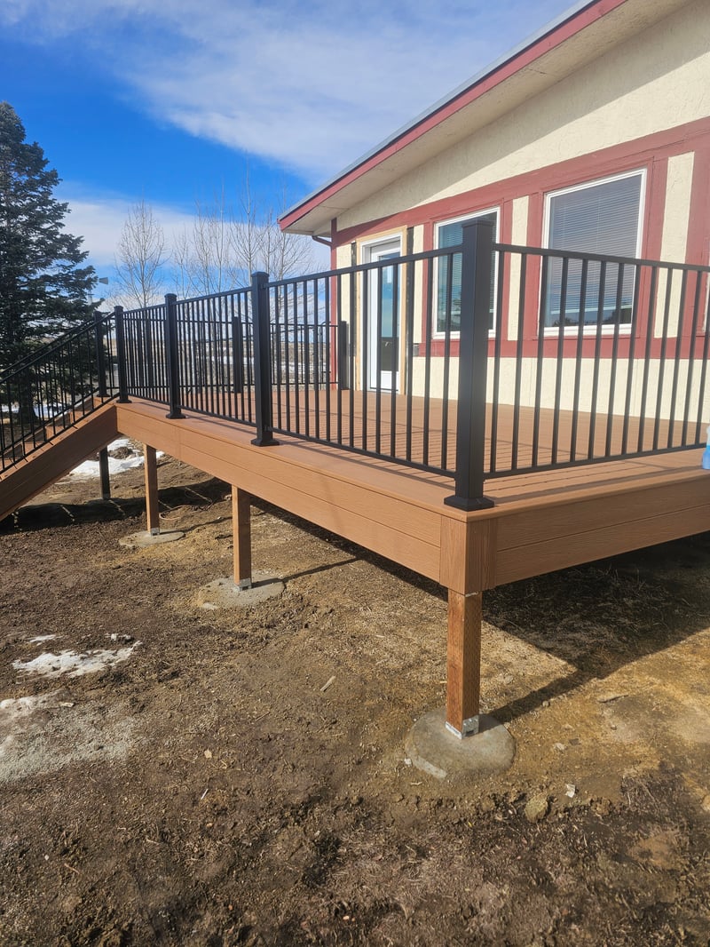 Backyard deck with pergola and outdoor dining area