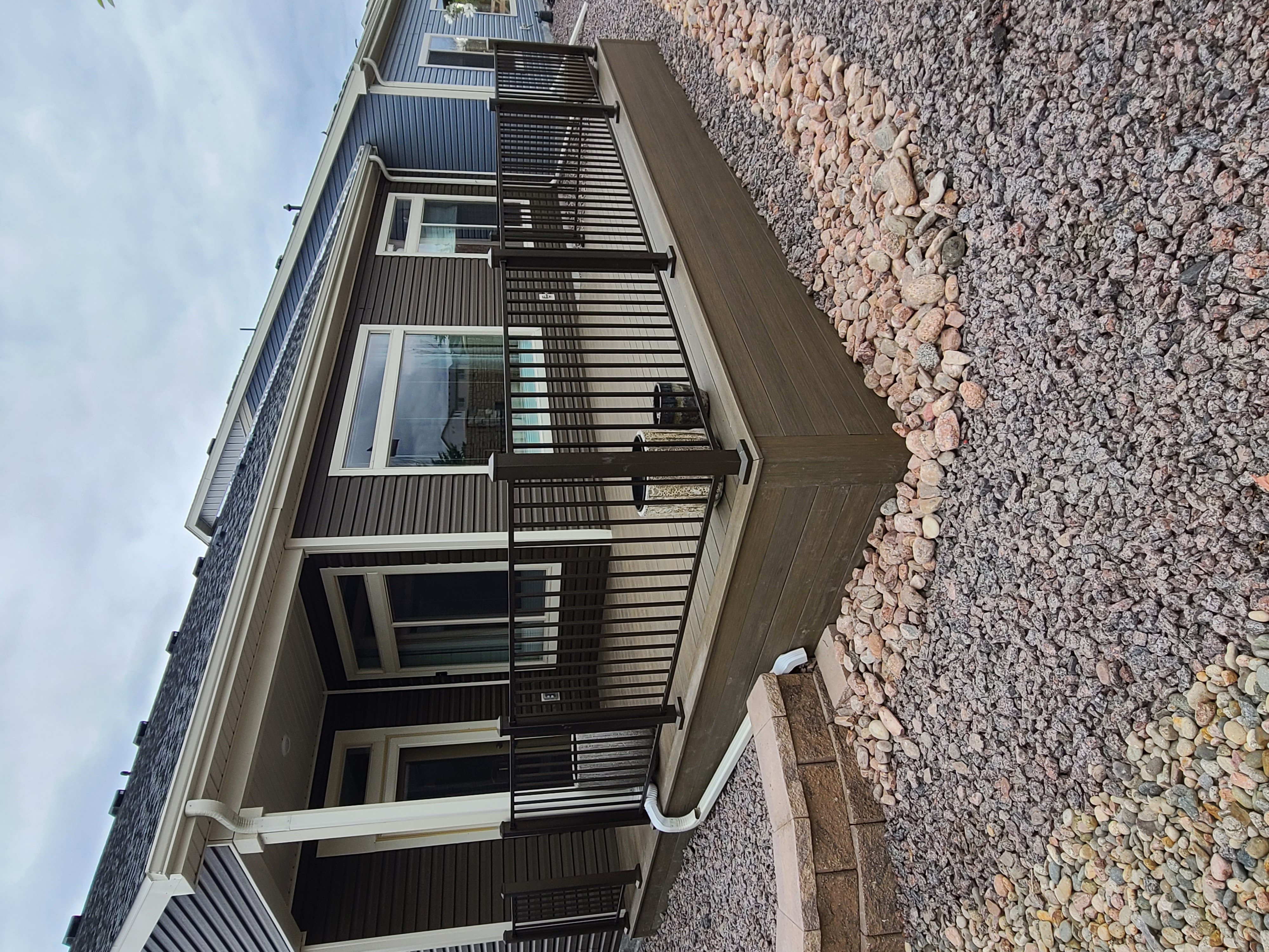Finished composite deck with picture-frame border detail