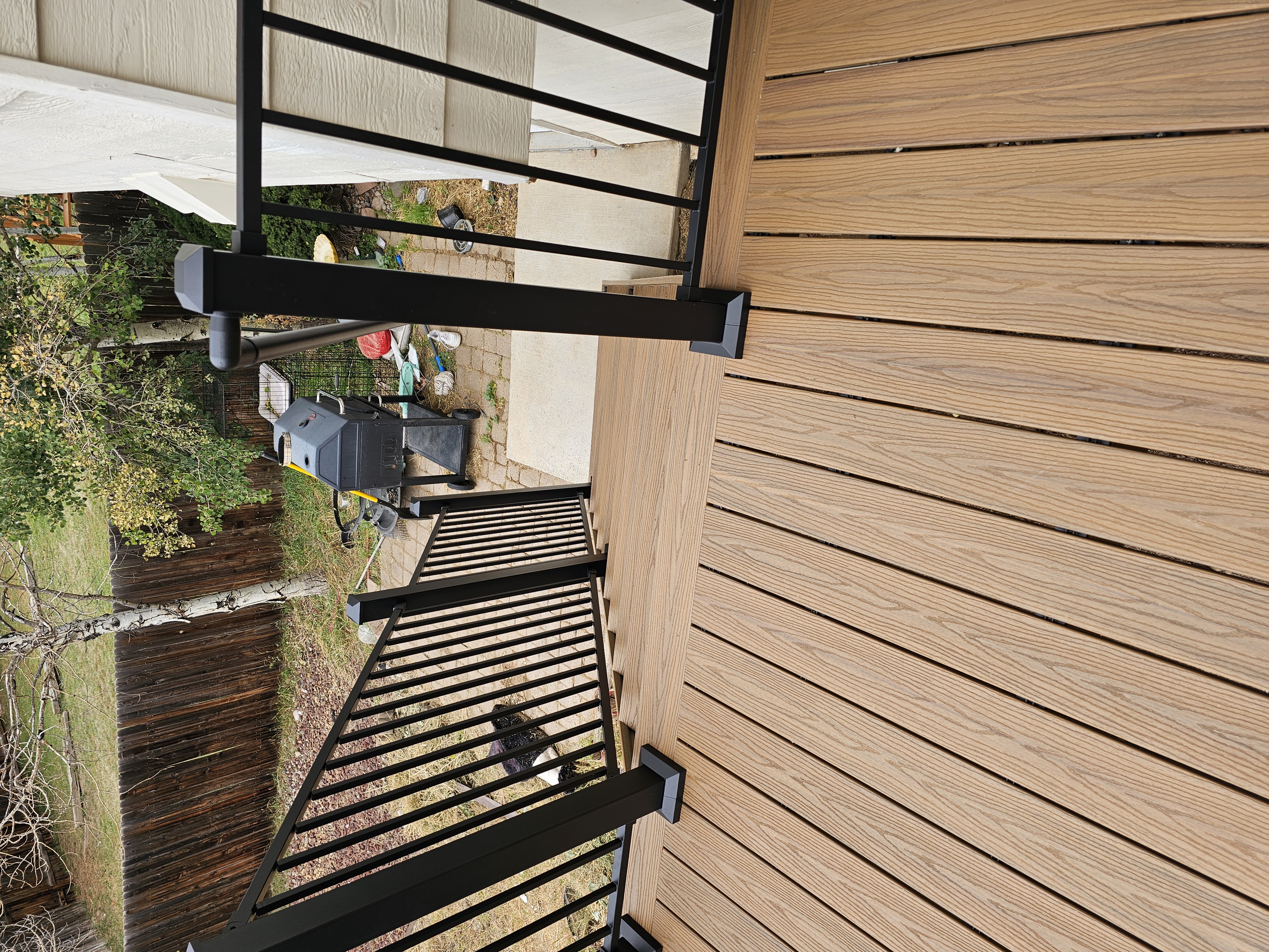 Covered patio and outdoor living space attached to a Colorado Springs home