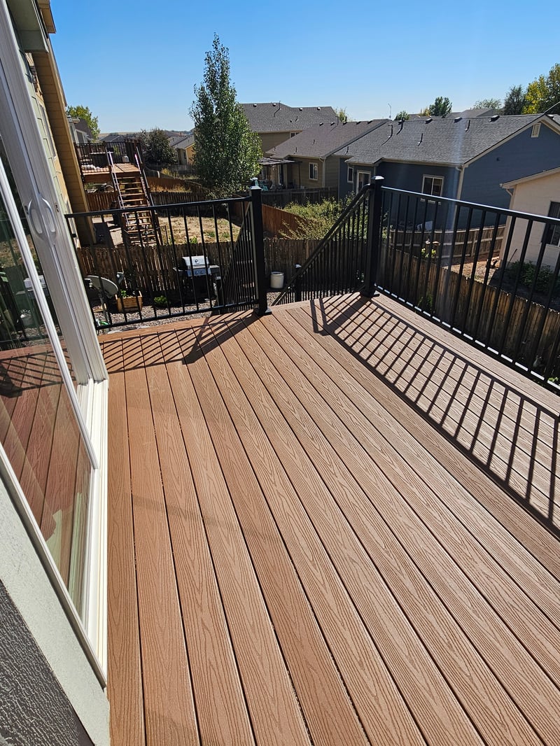 Finished composite deck with picture-frame border detail