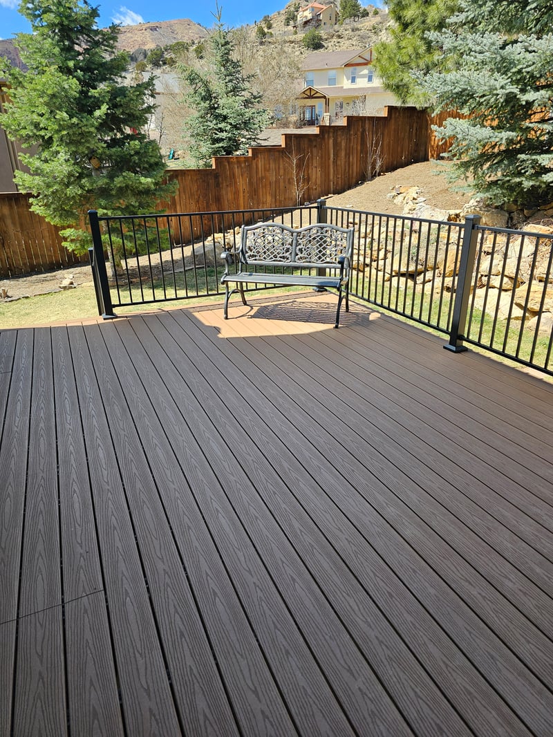 Finished composite deck with picture-frame border detail