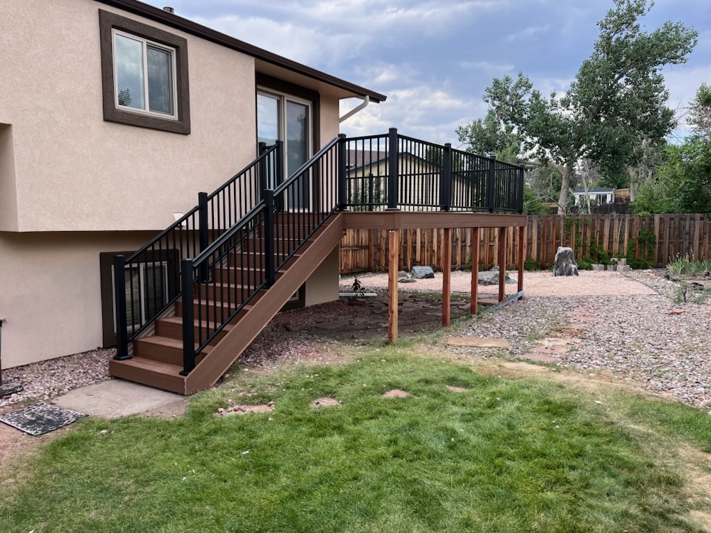 Backyard deck with pergola and outdoor dining area