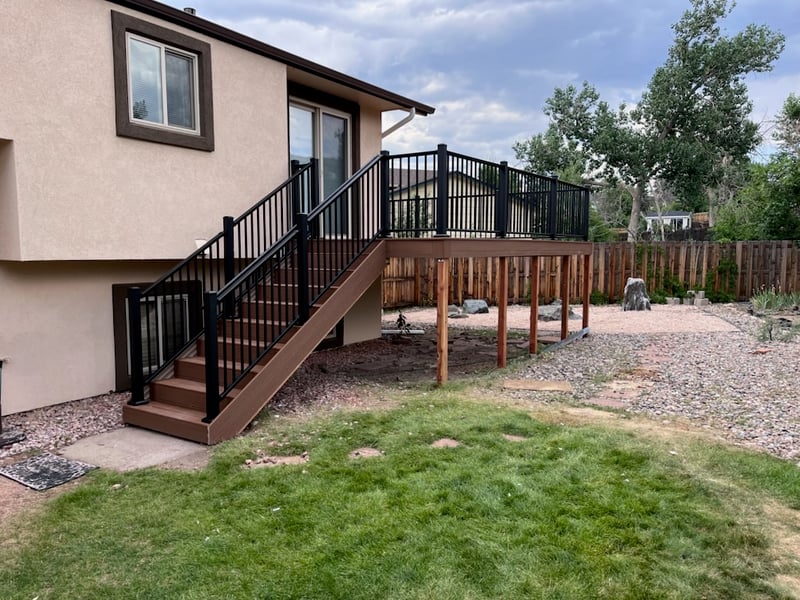 Backyard deck with pergola and outdoor dining area